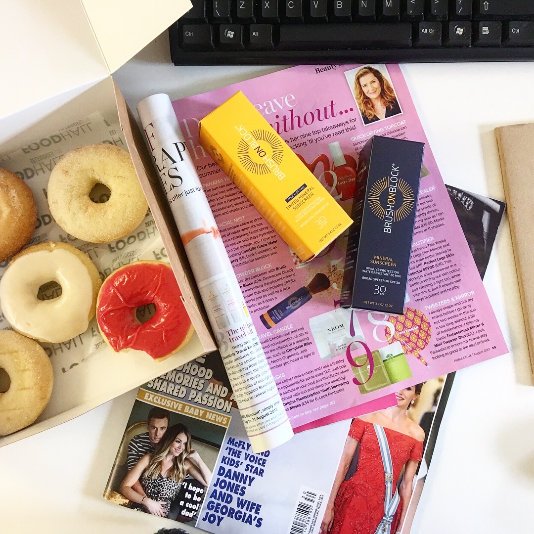 flatlay of Brush on Block on top of magazines