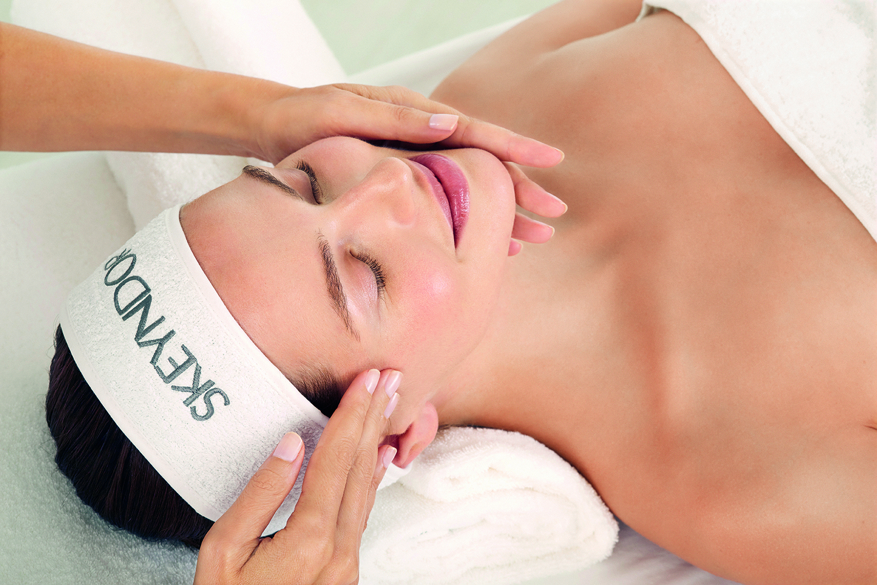 Image of a woman receiving a facial treatment