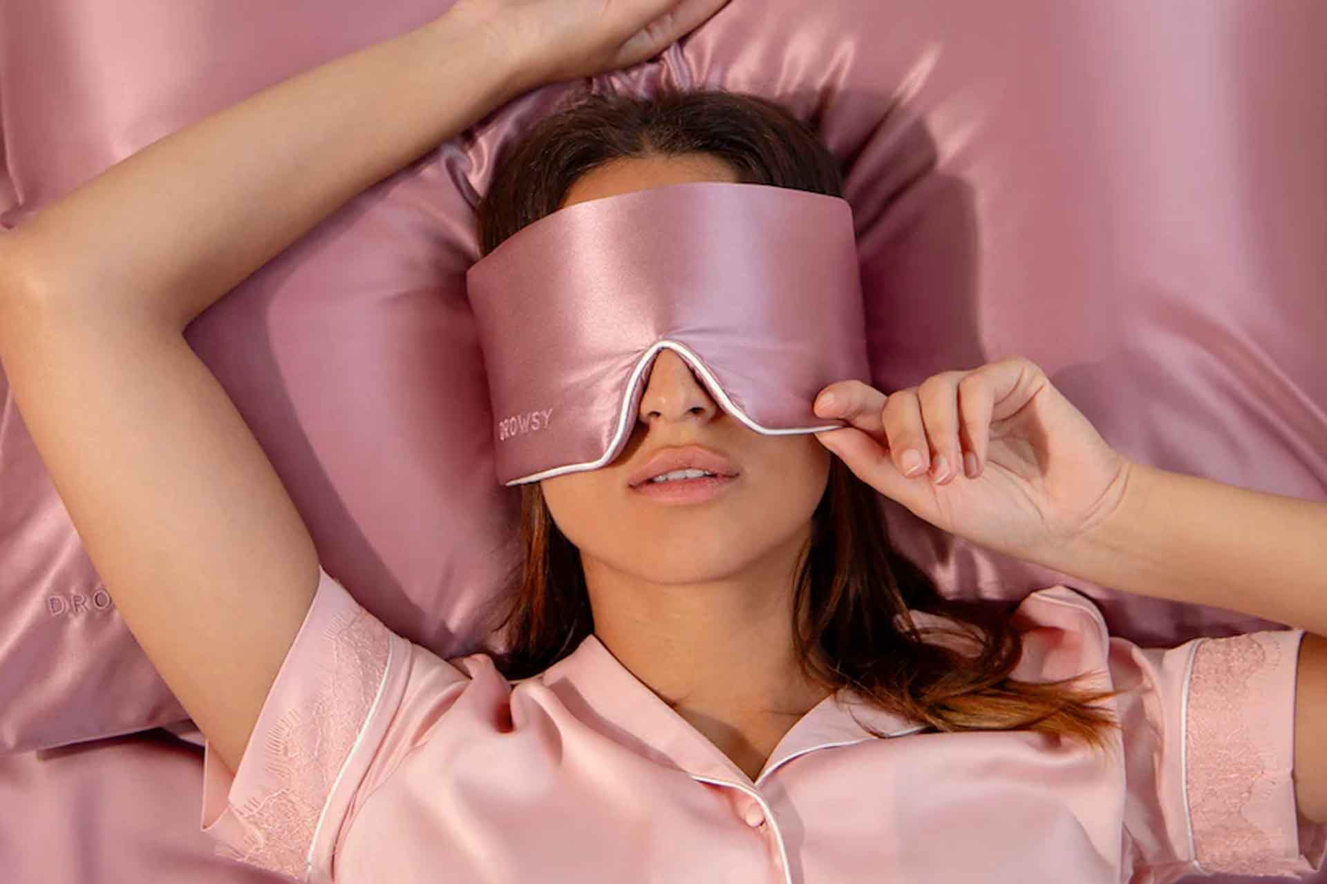 Image of a woman wearing a Drowsy sleep mask