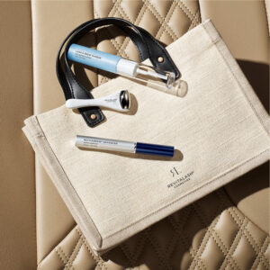 RevitaLash Cosmetics Summer Ultimate Brow Collection with products and beach bag