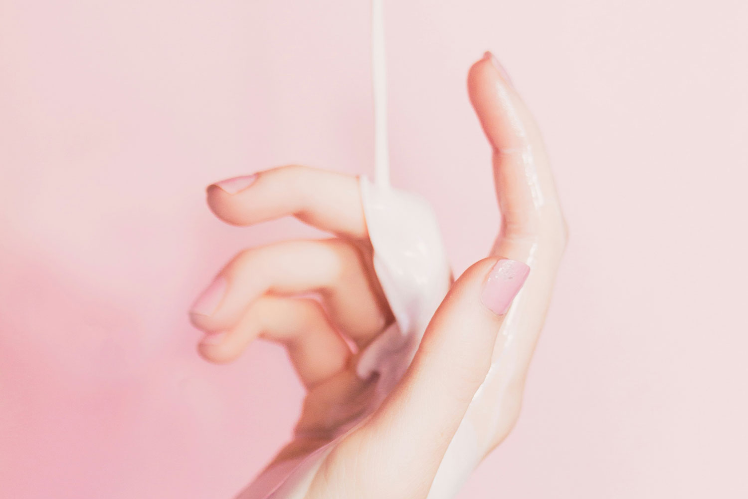 lotion being poured onto a hand