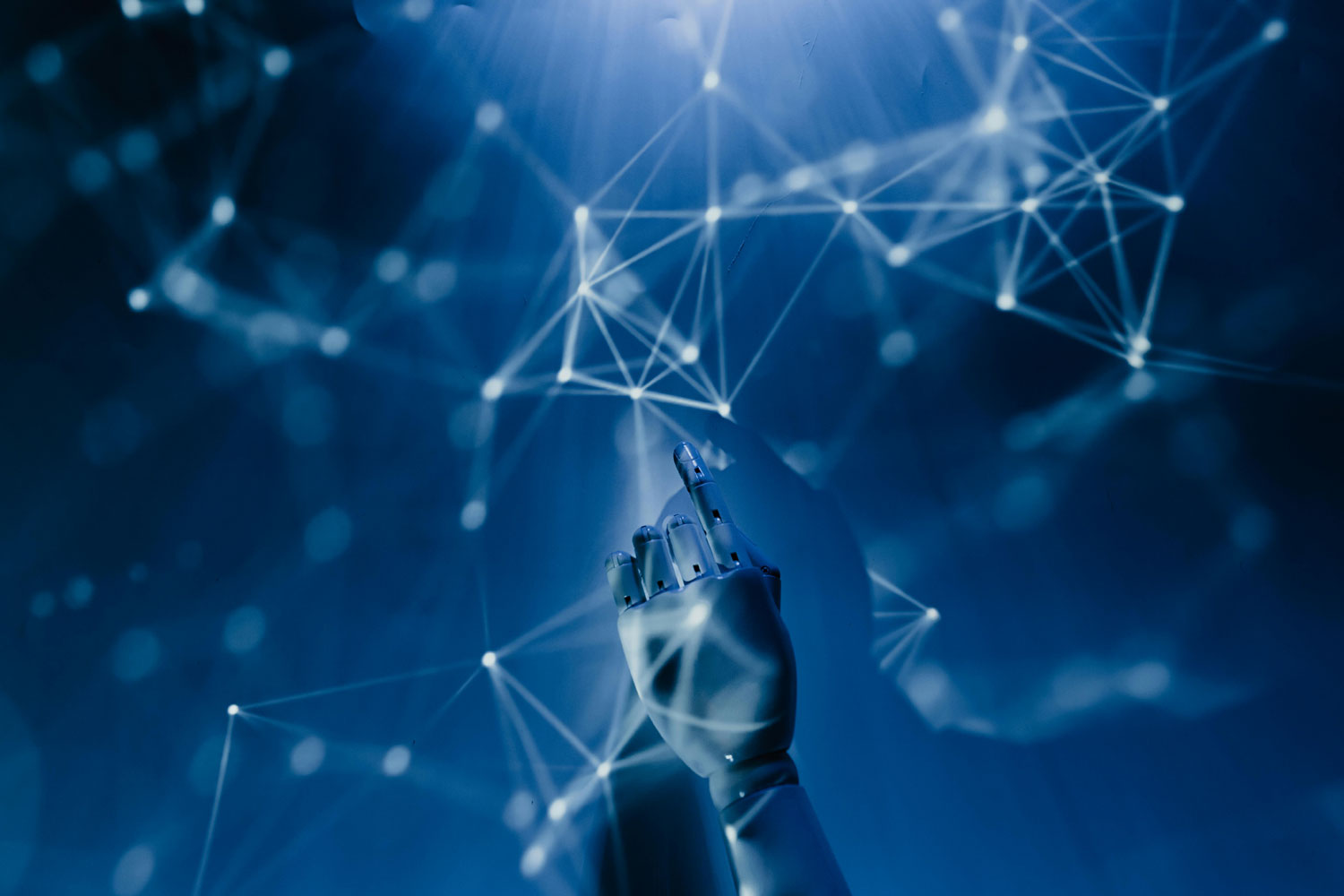 Robot hand to represent AI in a blue background